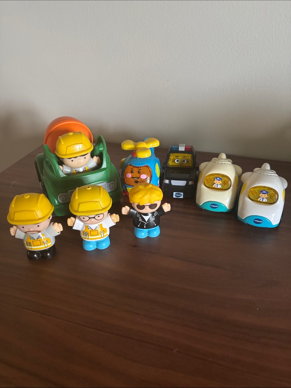 Vtech vehicles and construction workers toys figures.